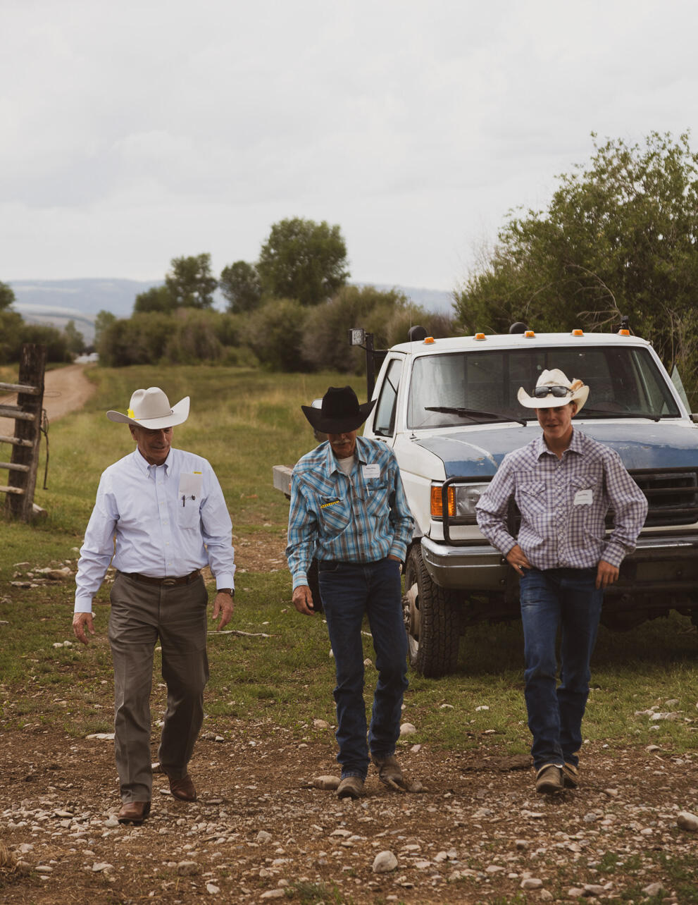 Governor Mark Gordon (left) returns from touring the Miller ranch with Mike Miller (center) and grandson Kaleb Miller.
