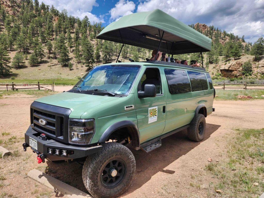 A custom van with a expandable roof.