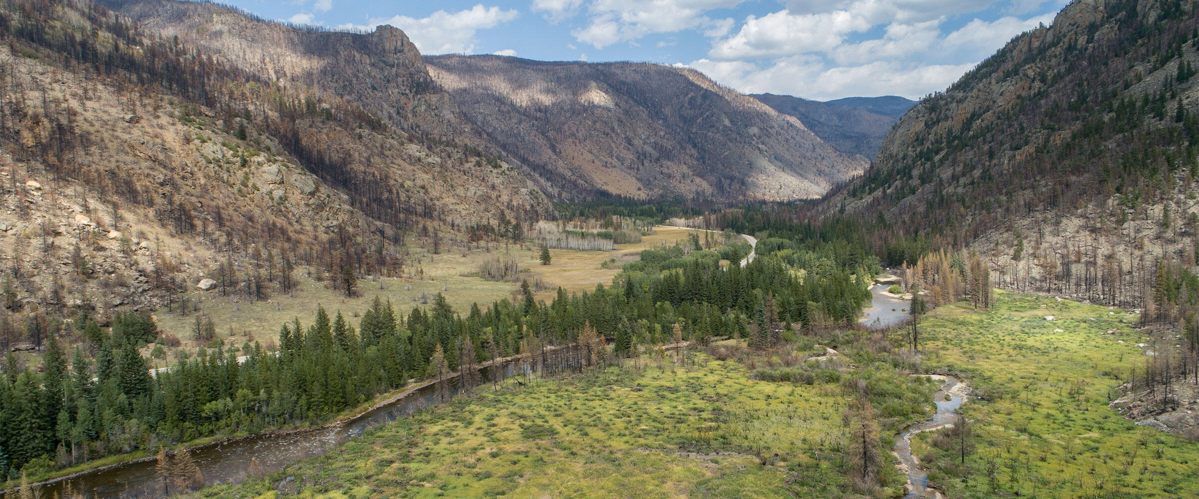 A river runs through a mountain valley.